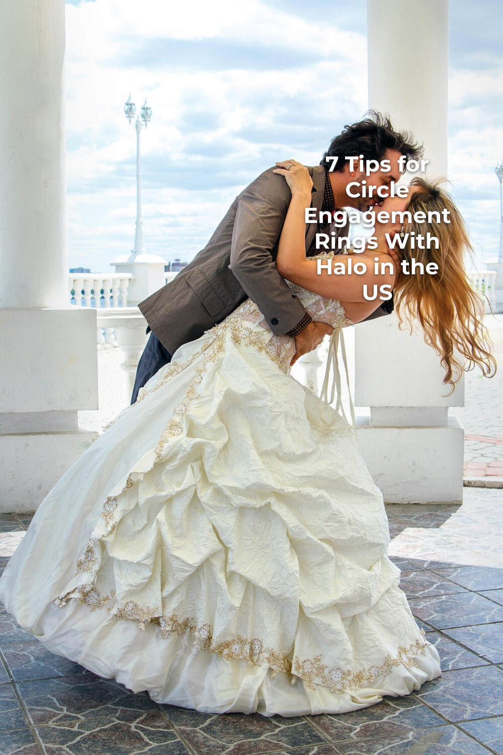 Circle Engagement Rings With Halo Wedding Kiss circle engagement rings with halo bride and groom kissing between white columns outdoors