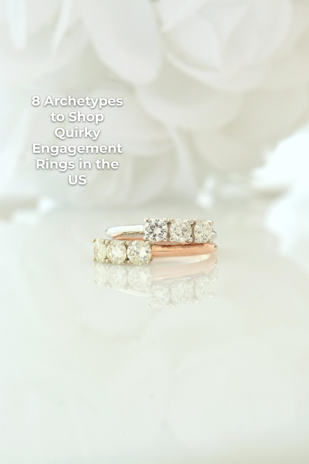 Quirky engagement rings with gemstone settings in silver and rose gold on a white reflective surface