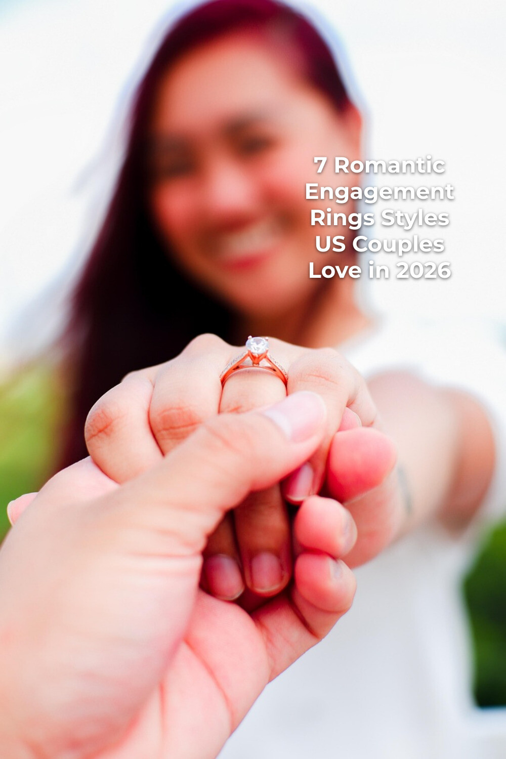 Dreamy Romantic Engagement Rings Close-Up Romantic engagement rings close-up as a person in a white top holds a hand forward showing a ring