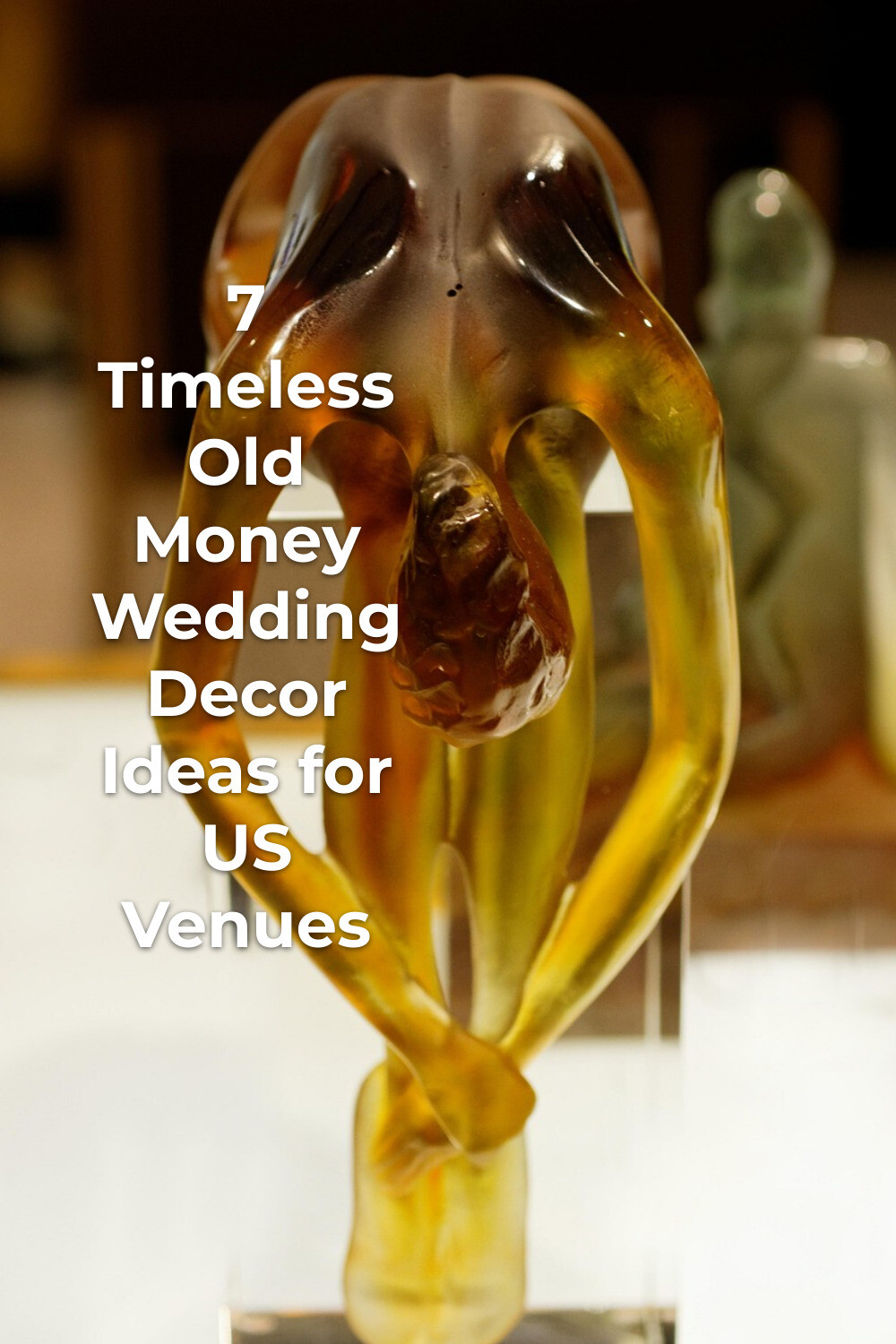 Amber glass nude figure sculpture for old money wedding decor on an elegant tabletop