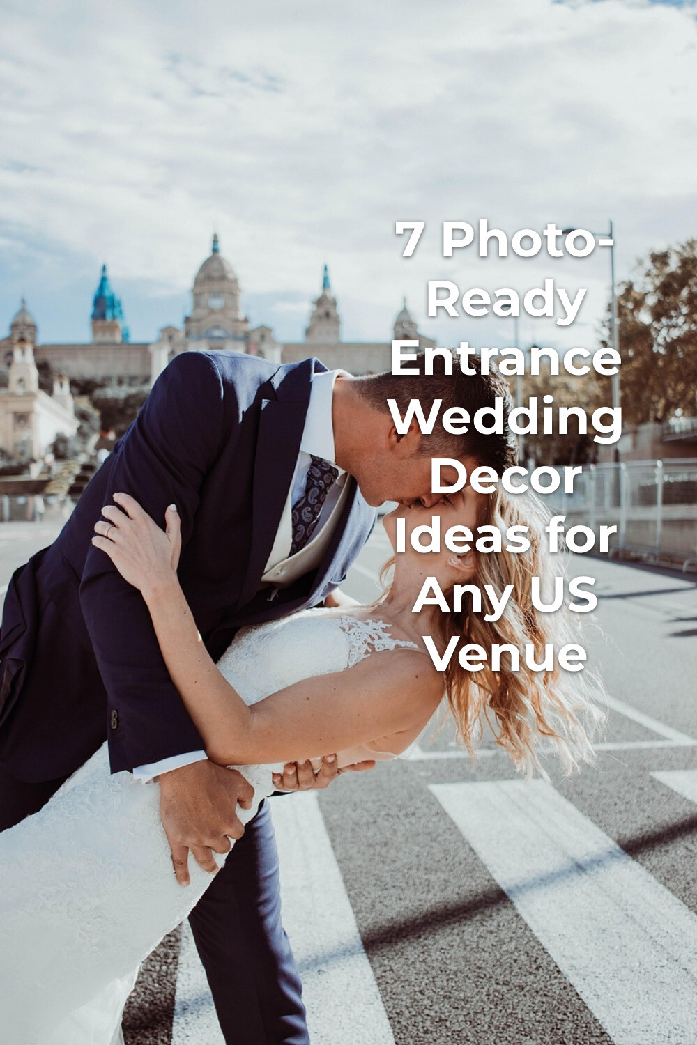 Entrance wedding decor moment as groom dips and kisses bride on a city crosswalk with trees and buildings behind