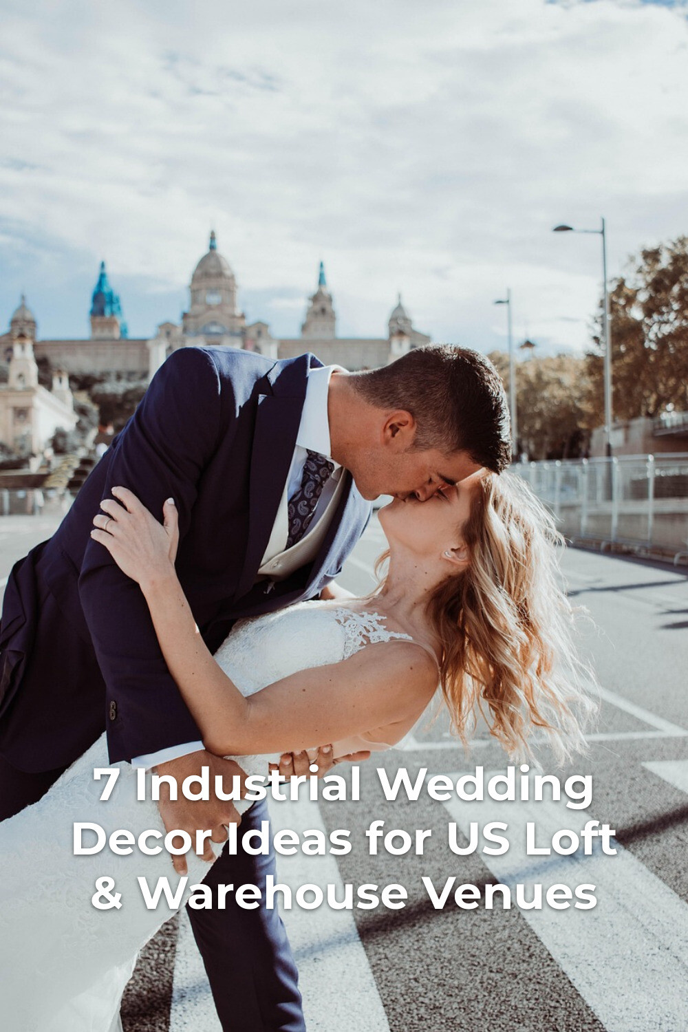 Industrial wedding decor editorial: groom dips and kisses bride in lace dress on a city crosswalk