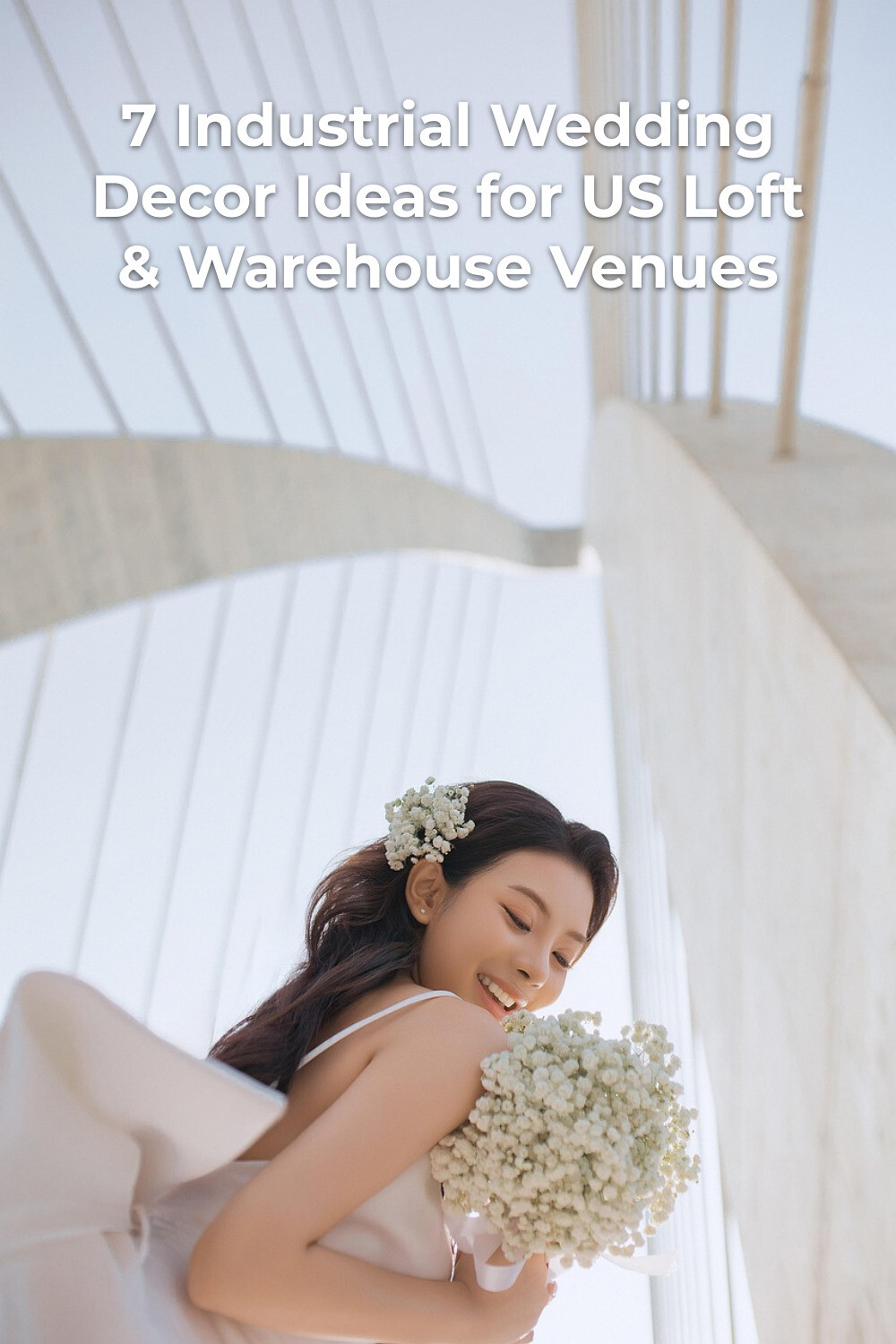 Industrial wedding decor editorial photo of woman in light dress holding white flower bouquet under a large bridge