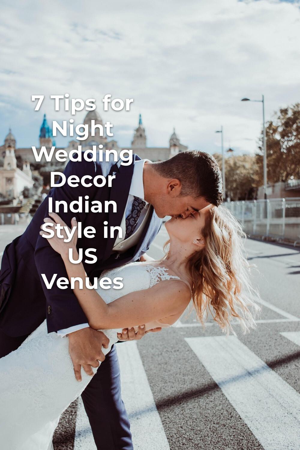 Night wedding decor indian inspiration as a groom dips his bride for a kiss on a city street crossing