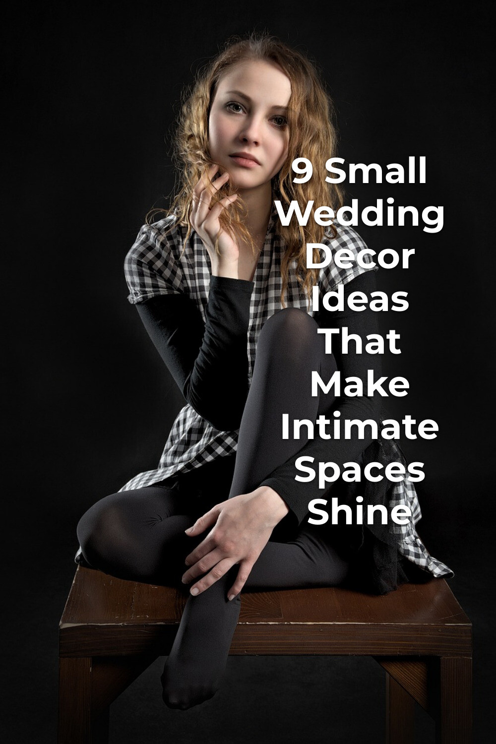 Small wedding decor inspiration: young woman in checkered dress on wooden bench against a dark background