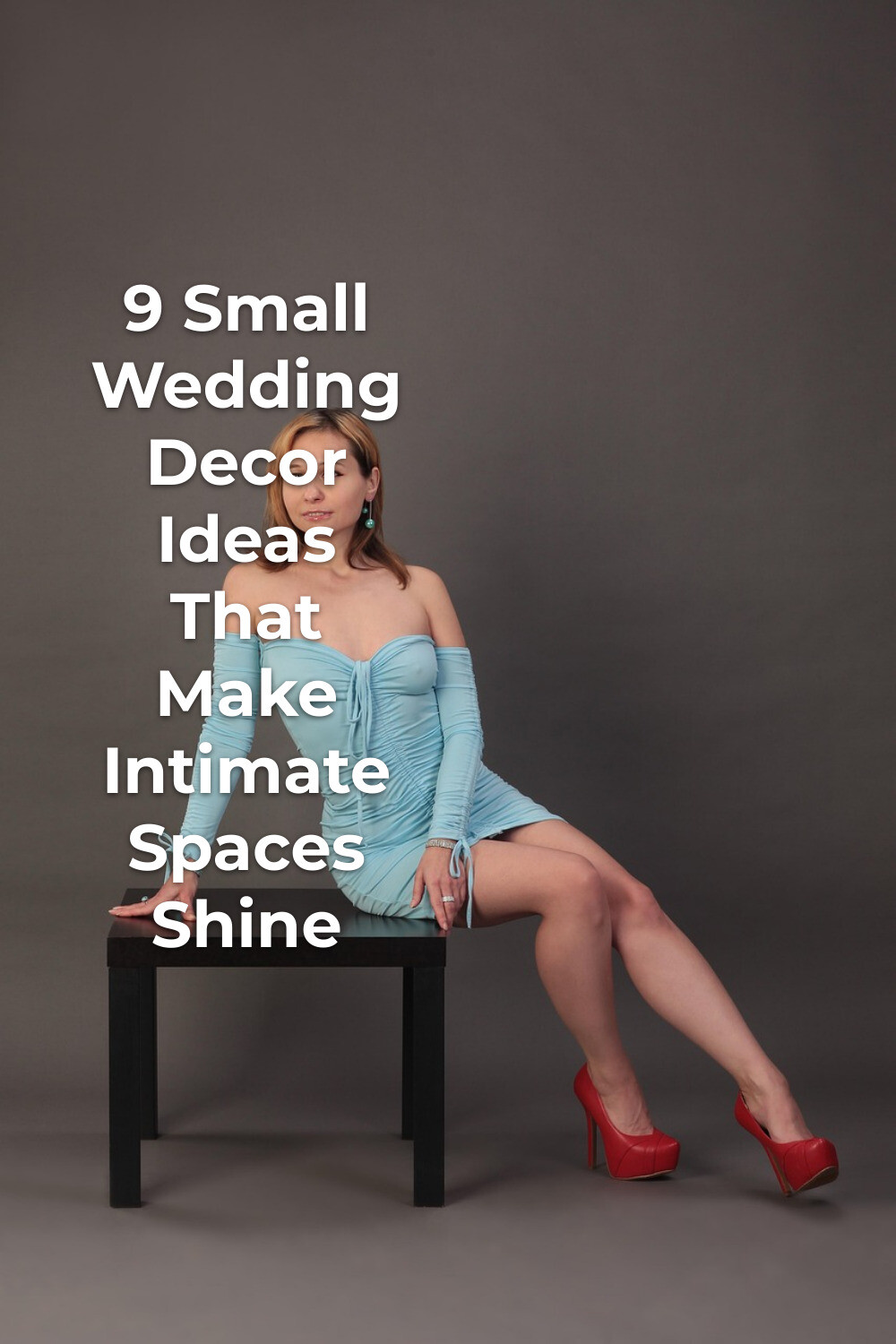 Small wedding decor inspiration: woman in light blue off-shoulder dress and red heels sitting on a black table