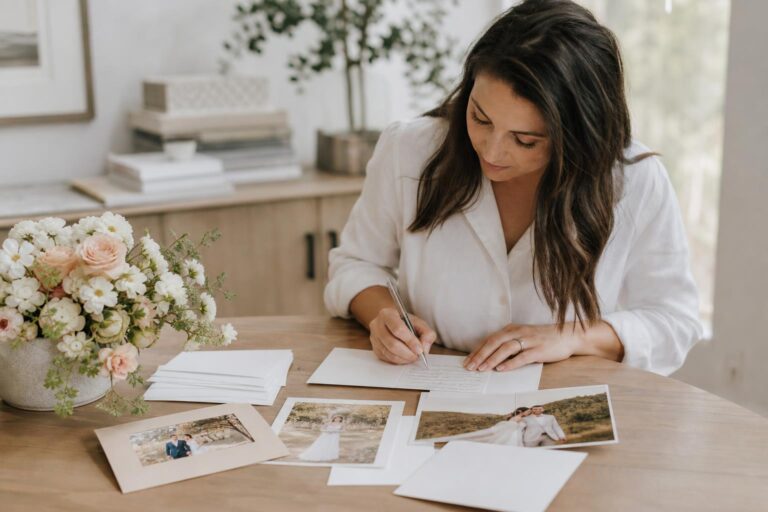 Elegant wedding thank you cards with handwritten notes and envelopes on a light desk, classic stationery flat lay