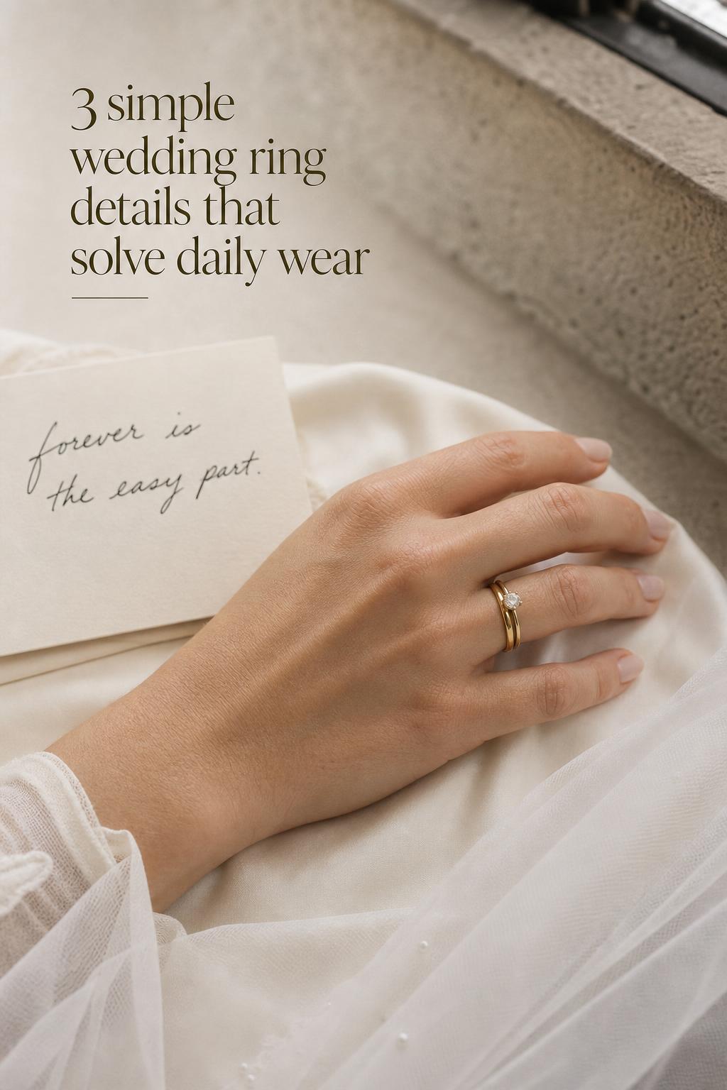 Simple wedding ring close-up of a polished yellow-gold band on bride’s hand atop ivory silk with subtle solitaire ring
