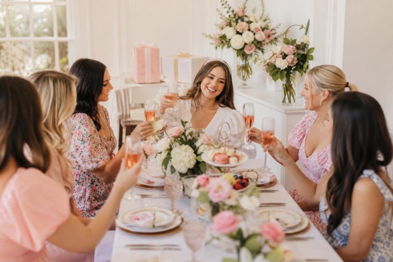 Bridal shower theme ideas with spring garden party tablescape, pastel florals, champagne glasses, and elegant place settings