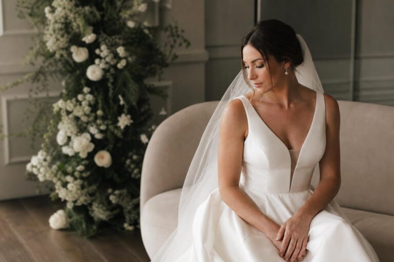 Timeless bridal style portrait of a bride in an elegant gown with soft light, calm makeup, and refined details