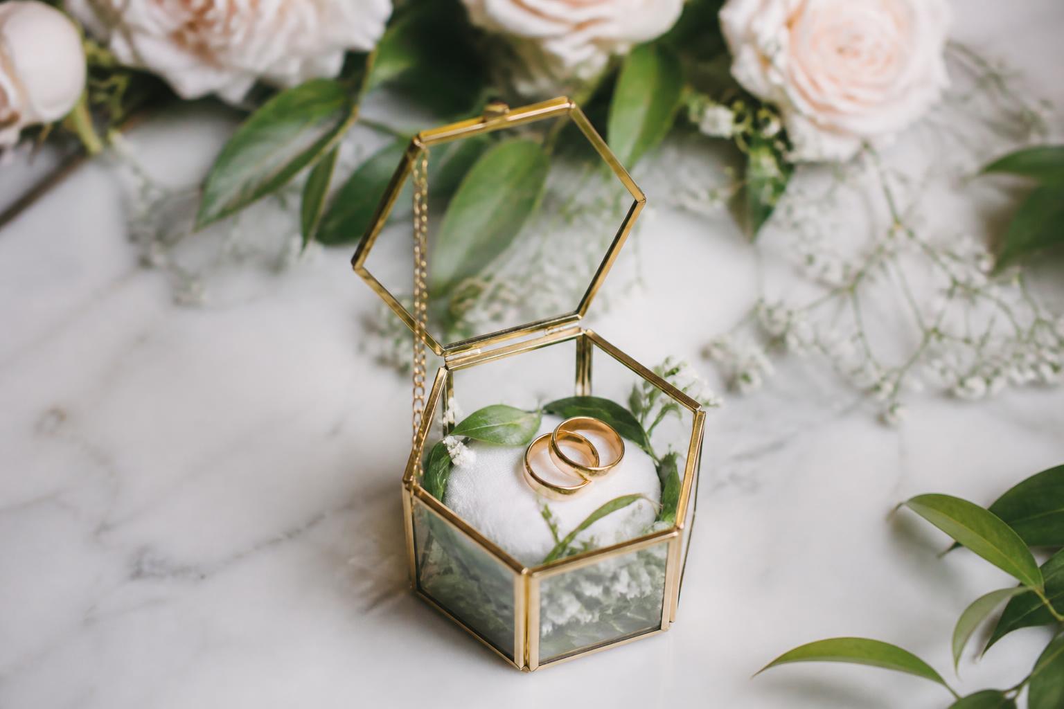 Velvet ring box on a ceremony table, elegant ring holder wedding detail for secure vows and timeless photos