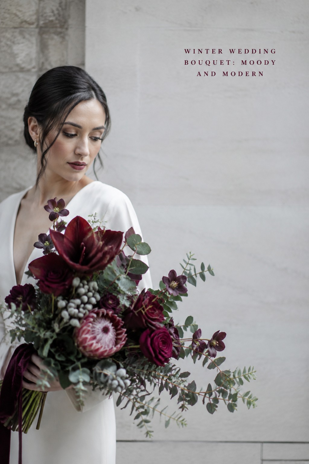 Ivory winter wedding bouquet with white anemones and silver foliage